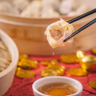 a bowl of soup and chopsticks