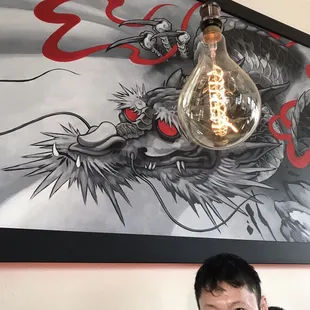 Oversized Edison bulb lighting, angry dragon motifs, and my friend who convinced me to eat here