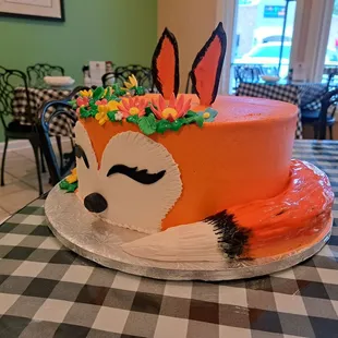 a cake decorated like a fox