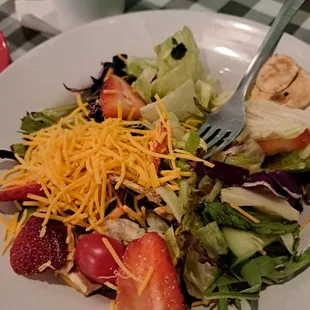 Side salad with added mushrooms, strawberry, and chz but no croutons