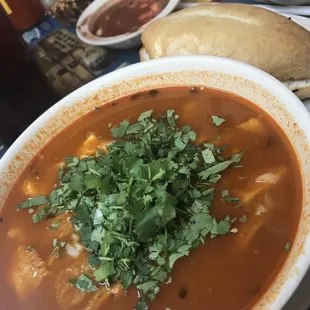 a bowl of soup and a sandwich