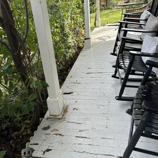 The wraparound porch at the front entrance is very dilapidated