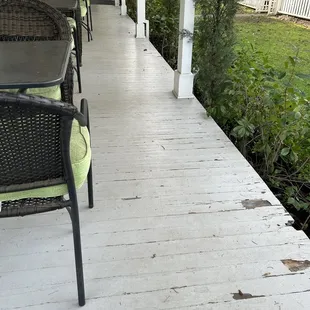 The wraparound porch is dilapidated and needs to be repaired