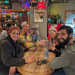 a group of men sitting at a table