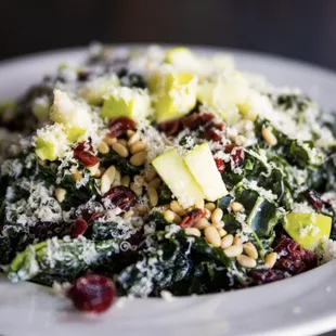a white plate with a salad on it