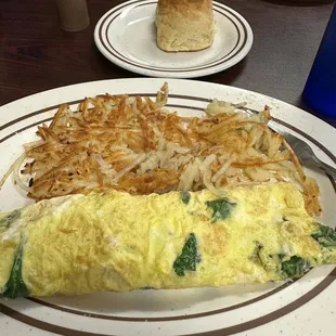 Feta and spinach omelette with home fries and biscuit