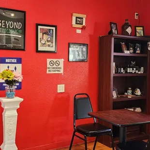 a dining room with red walls