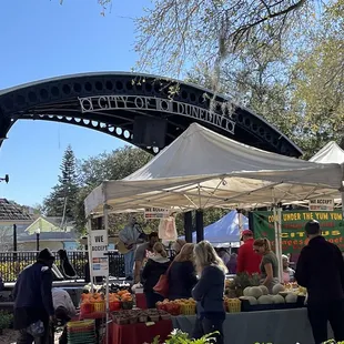 people shopping under a canopy
