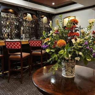 Lobby flowers and bar.