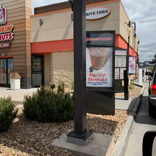  the outside of a dunkin'donuts store