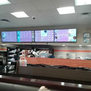  a view of the inside of a dunkin donuts shop