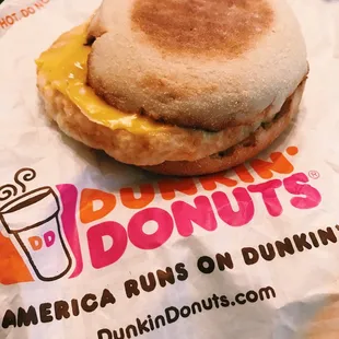  an english muffin sandwich on a dunkin donuts wrapper