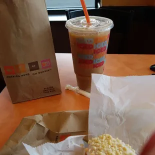  a donut and a drink on a table