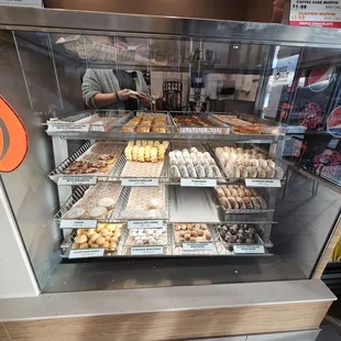  a display of donuts in a bakery