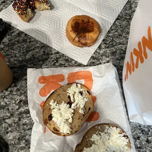  a bagel and a sandwich on a table