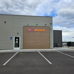  the entrance to a dunkin donut shop