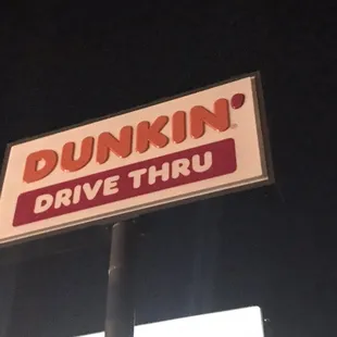  a drive thru sign at night