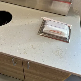 Tables and counters had coffee everywhere.  But people were too busy playing around to clean anything up.