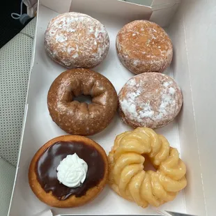  a variety of donuts in a box