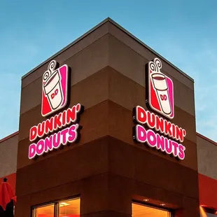 the front of a dunkin donuts restaurant
