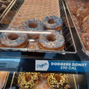 a variety of doughnuts in a display case