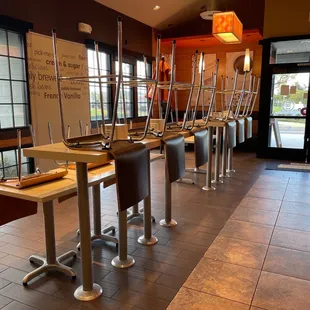  a row of empty tables in a restaurant