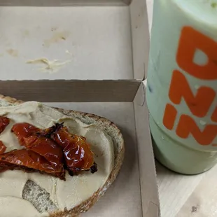Hummus &amp; roasted tomato toast, iced matcha latte