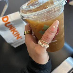  a drink in a plastic cup with a straw