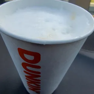 Hot machiatto with whole milk and lots of white foam on top. This comes standard with 2 shots of espresso no matter what size you get.