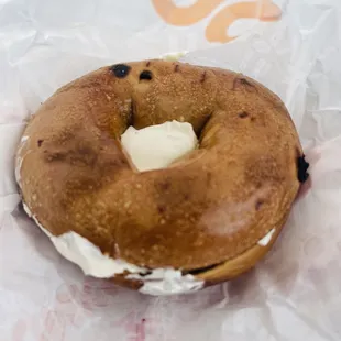 a bagel with cream on it