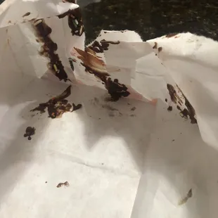 Chocolate frosted donut bag with sprinkles.