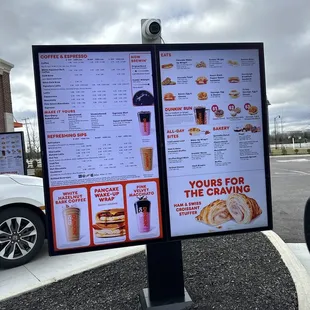 a menu and a car in a parking lot