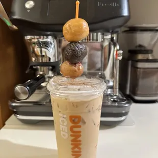 My sad espresso machine with the Mighty Dunkin'g  taunting it.