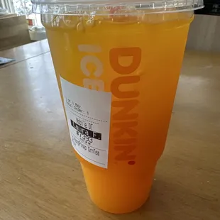  a drink in a plastic cup on a table