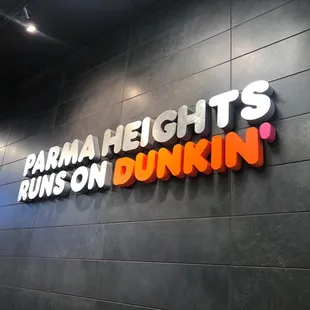  a sign that says farm height is runs on dunkin