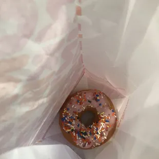 Strawberry iced with sprinkles.