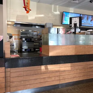  the counter area of a dunkin donuts restaurant
