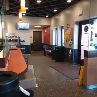 5 stools to eat at the bar and 3 outlets,. Comfy chairs and table near window. Community bulletin board to right of door.