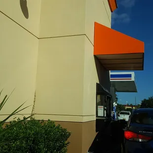  a parking lot with cars parked in front of it