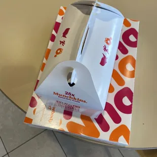  a box of dunkin donuts on a table