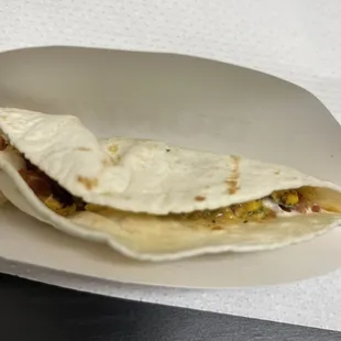 Breakfast Taco with Bacon? Is this what 2.99 Dunkin' taco looks like? I will not even give a dime.