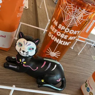  a black cat figurine on a table