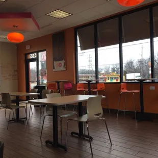  a view of the inside of a dunkin donuts restaurant