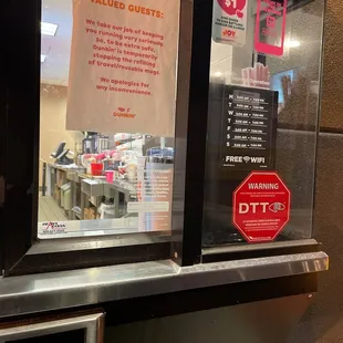  a sign in a window of a restaurant