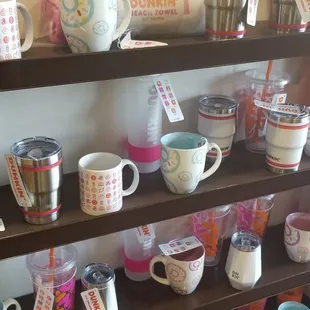  a shelf full of coffee mugs