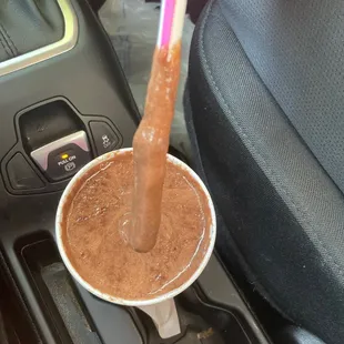  a cup of hot chocolate in a car