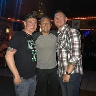 three men posing for a picture