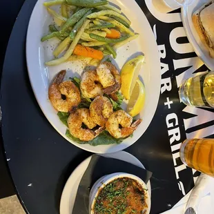 a plate of shrimp and vegetables