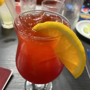 a drink with a slice of lemon