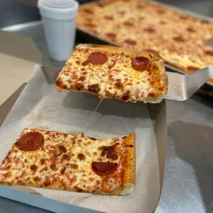 two slices of pepperoni pizza